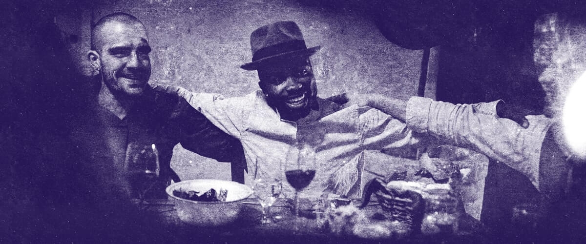 Picture of people sitting at the table for the at the table with Jesus page